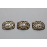 A SET OF THREE GEORGE III WINE LABELS with borders of husks, vine leaves and grapes, pierced "