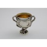 A GEORGE IV CAST TWO-HANDLED CUP naturalistic, with acorn and oak leaf handles, an oak stem and a