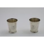 A PAIR OF VICTORIAN BEAKERS plain, tapering cylindrical form with moulded bases, engraved on one