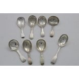FOUR ANTIQUE FIDDLE PATTERN CADDY SPOONS with engraved bowls and four other Fiddle pattern caddy