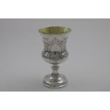 A VICTORIAN GOBLET with a campana-shaped bowl, embossed decoration and a vacant cartouche, gilt