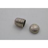 A GEORGE III ACORN-SHAPED NUTMEG GRATER with chased decoration, a screw cover and a lift-out,