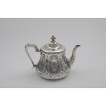 A VICTORIAN ENGRAVED TEA POT with a squat, tapering hexagonal body, and a domed cover with a knop