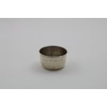 A GEORGE I NORTH COUNTRY TUMBLER CUP of shallow circular form with a slightly flared rim,