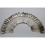 OLD ENGLISH PATTERN:- A set of seven George III table spoons, crested, by George Smith and William