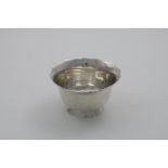 A LATE 18TH CENTURY SWISS SMALL BOWL with a shaped and everting rim and a slanting collet foot,