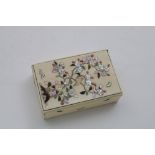 A JAPANESE IVORY AND SHIBAYAMA BOX inlaid with a bird (missing) on a tree branch; 9.5 x 6 cms