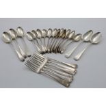 OLD ENGLISH PATTERN:- A set of twelve George III dessert spoons, crested, probably by William Smith,