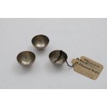 A SET OF THREE QUEEN ANNE MINIATURE OR TOY TEA BOWLS plain hemispherical on reeded collet bases,