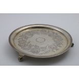 A 19TH CENTURY PORTUGUESE SALVER of plain circular form with a reeded rim, engraved floral