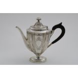 A LATE VICTORIAN VASE-SHAPED COFFEE POT with engraved and fluted decoration and vacant shield