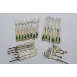 A VICTORIAN SET OF SIX ENGRAVED FISH KNIVES AND EIGHT FISH FORKS with ivory handles and a green-