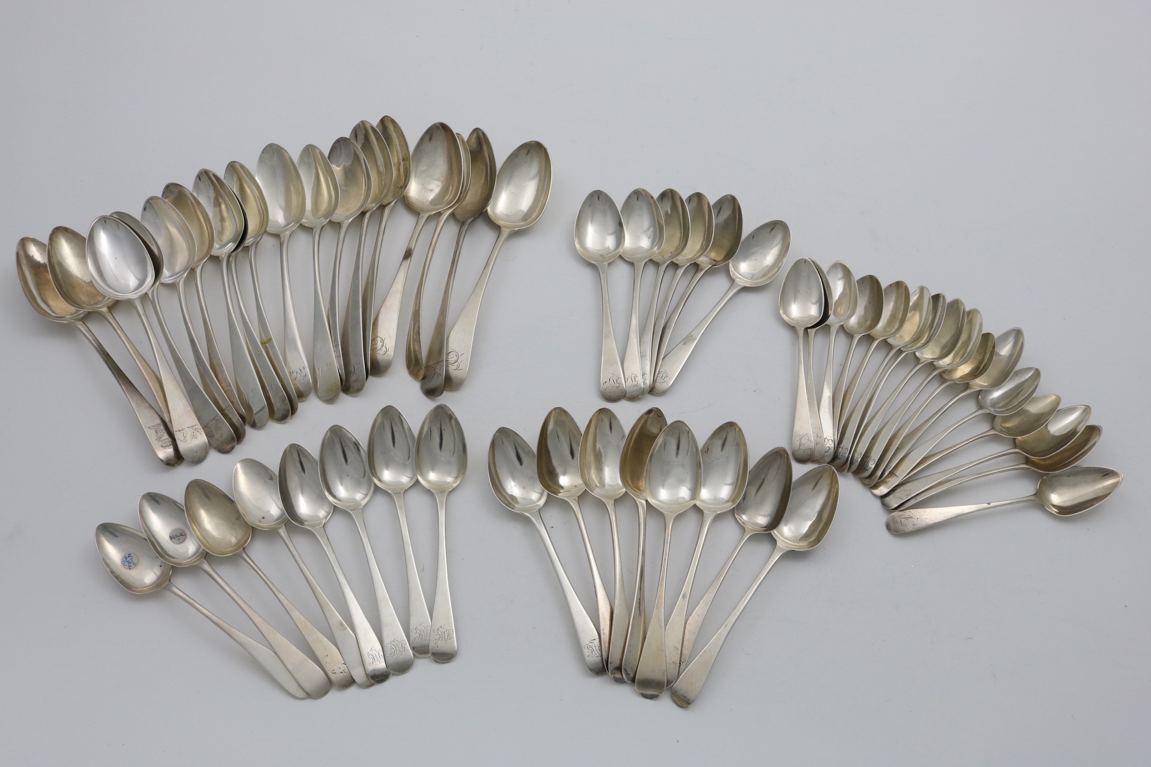 OLD ENGLISH PATTERN:- Thirty two various George III tea spoons, eighteen various antique dessert