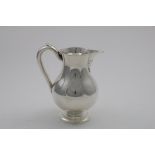 AN EARLY VICTORIAN BEER JUG of plain baluster form on a circular pedestal foot, by Robert Hennell,