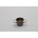 A GEORGE I MINIATURE OR TOY PORRINGER plain, with two, S-scroll handles and a slightly baluster