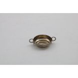 A CHARLES II MINIATURE OR TOY WINE TASTER of shallow circular form with wire S-scroll handles,