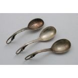 BY GEORG JENSEN OF COPENHAGEN:- A Danish spoon with a hammered bowl and a curved, Pea-pod pattern