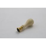 A 19TH CENTURY GOLD-MOUNTED IVORY SEAL with a baluster handle and a bloodstone matrix with an