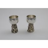 BY GRAHAM WATLING OF LACOCK:- A pair of late 20th century handmade goblets, the conical stems with