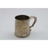 A LATE 18TH / EARLY 19TH CENTURY MUG with a reeded base and rim and an angular handle, chased on the