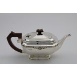 A LATE 20TH CENTURY TEA POT rectangular with canted corners and a gadrooned border with a foliate