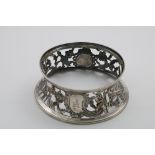 A GEORGE III IRISH DISH RING pierced and chased with figures, architecture, birds, flowers and a