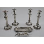 A SET OF FOUR LATE PERIOD OLD SHEFFIELD PLATED CANDLESTICKS with borders of vines and gadrooning,