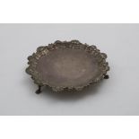 A LATE GEORGE II WAITER of shaped circular outline with a shell and scroll border, by William &