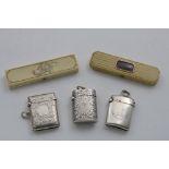 AN EDWARDIAN ENGRAVED VESTA CASE a late Victorian engraved vesta case, initialled, another with