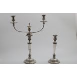 A SET OF FOUR OLD SHEFFIELD PLATED CANDLESTICKS on circular bases with tapering columns and