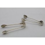 A PAIR OF ARTS AND CRAFTS SUGAR TONGS with a hammered finish, maker's mark only, by Omar Ramsden &