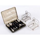 Silver A Pair of Four Division Toast Racks 1909 9cms Together with four various Silver Teaspoons and