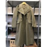A POST WAR ARMY GREATCOAT AND A COLLECTION OF OTHER ITEMS. An Army Greatcoat with label Greatcoat