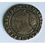 AN ELIZABETH I SIXPENCE. An Elizabeth I hammered sixpence with rose and date 1578, mm Greek cross