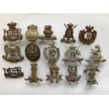 A COLLECTION OF CAP BADGES A collection of 36 military cap badges to include 3rd County of London