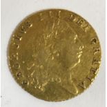 A GEORGE III HALF-GUINEA. A George III Half-Guinea dated 1802, the reverse with shield in garter,