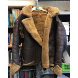 A LEATHER AND SHEEPSKIN FLYING JACKET. An Irvin type flying jacket, probably RAF World War II or