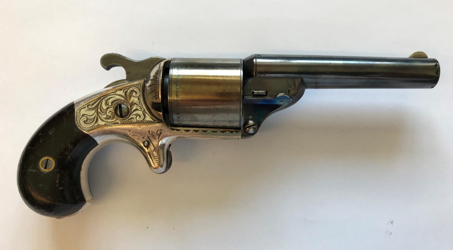 A MOORES PATENT SIX SHOT REVOLVER. A Moores Patent revolver with an 8cm blued barrel numbered 16086,