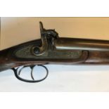 A REPRODUCTION PERCUSSION CAP DOUBLE BARREL SPORTING GUN. A reproduction 12 bore side by side doubel