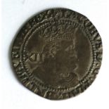 A JAMES I SHILLLING. A James I hammered silver shilling, mm Lis for 1604-1605.