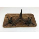 THREE MOUNTED CALTROPS. The larger central example formed from a single piece of metal, the two