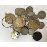 A COLLECTION OF PIERCED OR MOUNTED COINS. A collection of coins all of which pierced or mounted