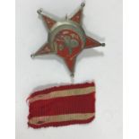 A TURKISH GALLIPOLI STAR. A five pointed star with red painted decoration and simple pin back,