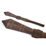 A TRIBAL CLUB, PROBABLY SAMOAN. A tribal club with pointed end and of geometric shape with central