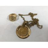 A NAPOLEON III 20 FRANC COIN. A Gold 20 Franc coin dated 1857, in a gilt metal mount and chain and a