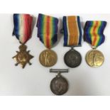 A POSSIBLE FAMILY CASUALTY GROUP OF FIRST WORLD WAR MEDALS. A group of three comprising 1914-15