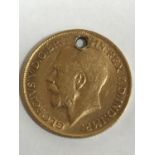 A SOVEREIGN. A George V Sovereign dated 1913, pierced for suspension, 7.9g.