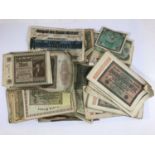 A COLLECTION OF WORLD BANKNOTES. A collection of World notes, many German to include 20,000