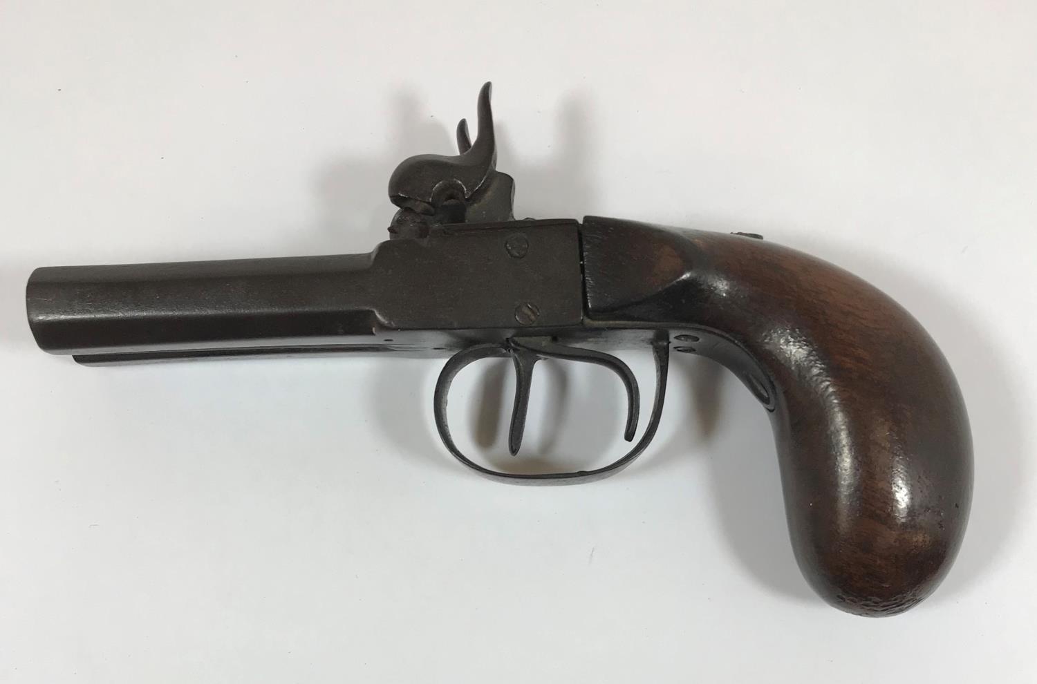 A 19TH CENTURY TWIN BARREL POCKET PISTOL. A small 19th century percussion cap firing pocket pistol