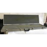 AN ALUMINIUM FIREARMS TRANSPORT CASE. A foam lined aluminium travelling case with four catches and